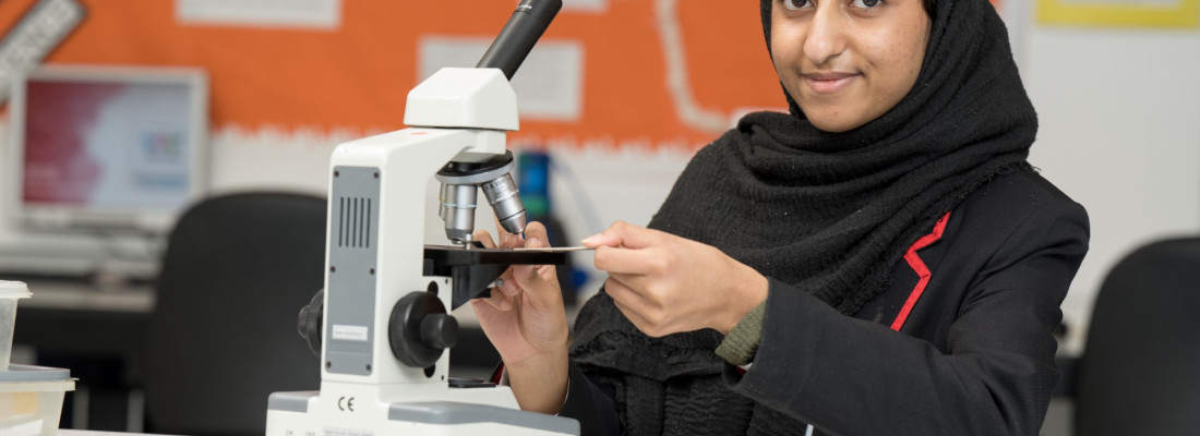 Student and microscope