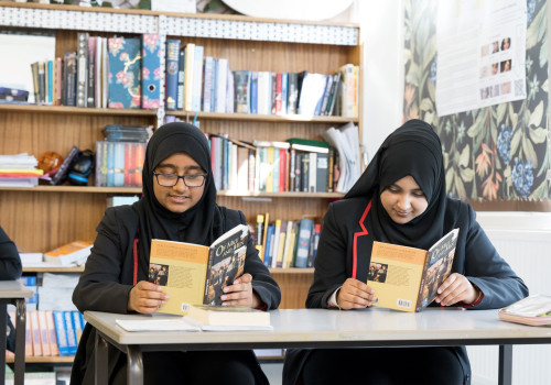 Two students reading books