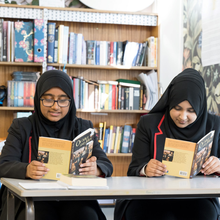 Two students reading books