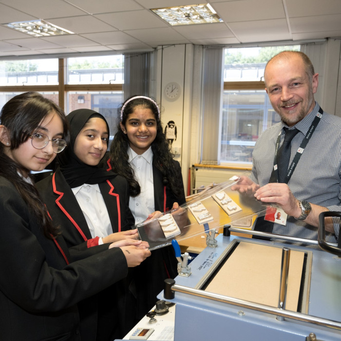 teacher and three students