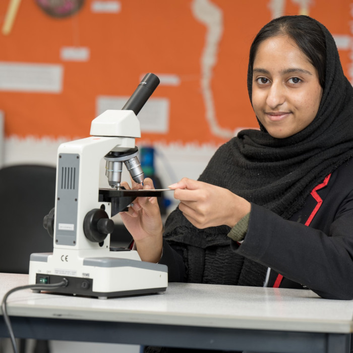 Student and microscope
